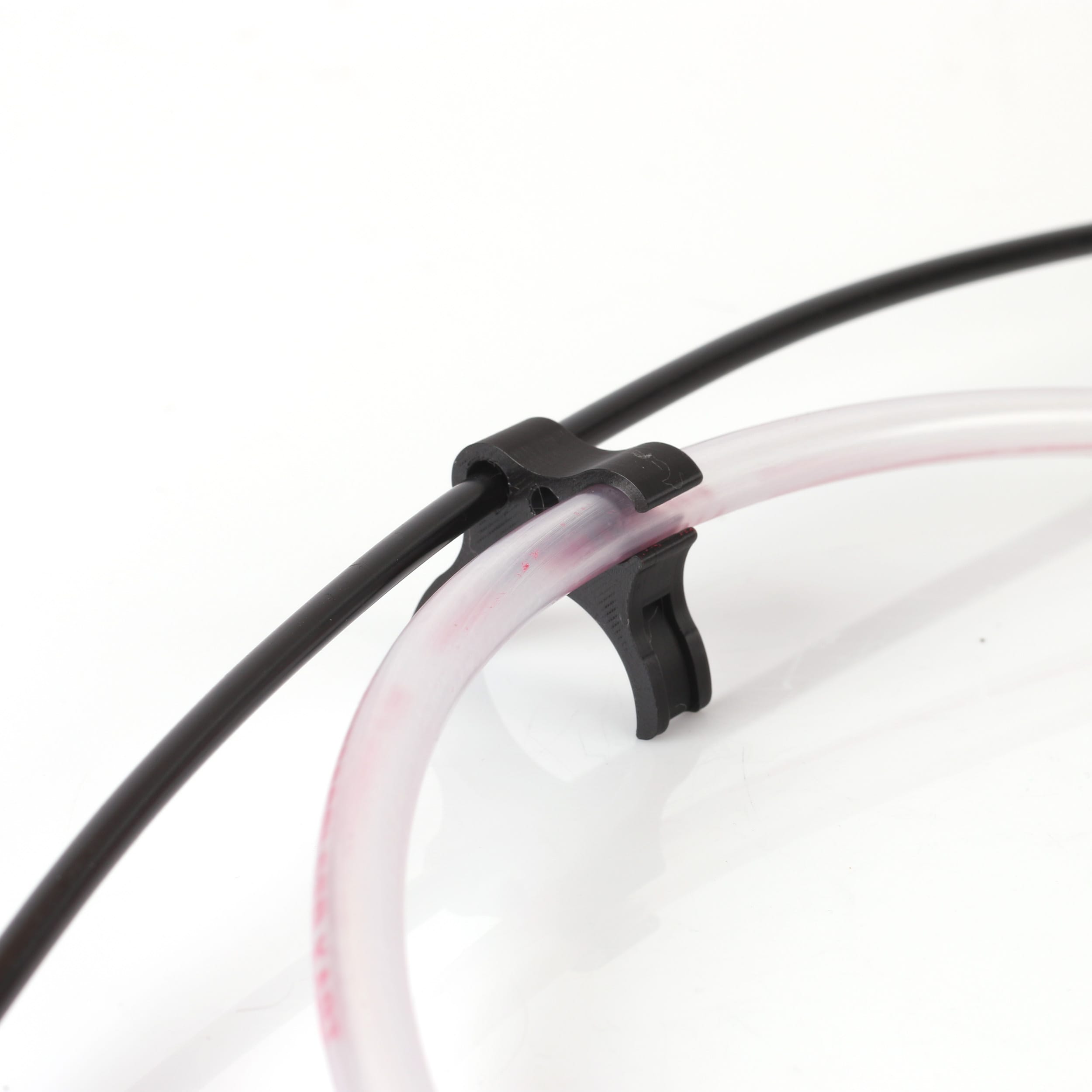 Holder for fuel hose and throttle cable red